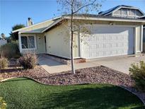 Charming one-story home with a two-car garage and low maintenance desert landscaping at 7008 Copperleaf Dr, Las Vegas, NV 89128