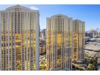 Stunning view of the luxury high-rise towers with shimmering gold glass exteriors and elegant architecture at 145 E Harmon Ave # 2608, Las Vegas, NV 89109