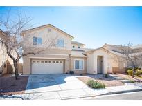 Charming two-story home with a two car garage and a low maintenance front yard at 3809 Champagne Wood Dr, North Las Vegas, NV 89031