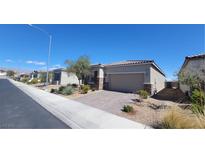 Charming single-story home with low maintenance desert landscaping and a brick paver driveway at 4708 Mindful St, North Las Vegas, NV 89031