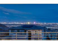 Enjoy panoramic city views from this multi-story home featuring solar panels at 522 Riley Ridge Ct, Henderson, NV 89012