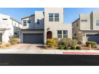 Contemporary two-story home with a two-car garage and desert landscaping at 524 Grand Cascade Pl, North Las Vegas, NV 89084