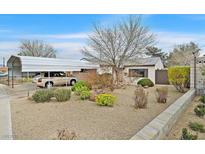 Charming single-story home featuring a covered parking area and desert landscaping for low maintenance at 657 Burton St, Henderson, NV 89015