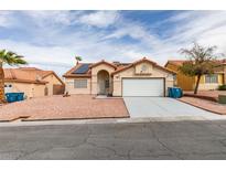 Inviting single-story home with a two-car garage, low-maintenance landscaping, and a neutral color palette at 6574 Curacao Dr, Las Vegas, NV 89156