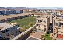 Beautiful home featuring multi-story architecture, a balcony, attached garage, and community playground at 8116 Haywood Estate Ave, Las Vegas, NV 89113