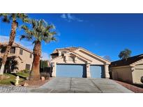 Charming two-story home featuring a three-car garage, desert landscaping, and a well-maintained front yard at 8316 Classic Villa Ct, Las Vegas, NV 89128
