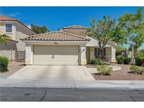 Charming single-story home with desert landscaping and a two-car garage at 2024 Riva Del Garda Pl, Las Vegas, NV 89134