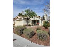Charming single-story home with a well-maintained yard, mature tree, and inviting facade at 2024 Riva Del Garda Pl, Las Vegas, NV 89134