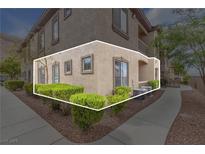Condo exterior with manicured landscaping, walkway and neutral-toned stucco at 3544 Desert Cliff St # 102, Las Vegas, NV 89129