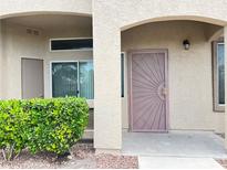 Inviting entryway with secure storm door and neat landscaping at 3544 Desert Cliff St # 102, Las Vegas, NV 89129