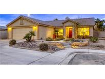 Charming single-story home with desert landscaping, appealing entrance and warm exterior lighting at 422 Tanita Ct, Las Vegas, NV 89123