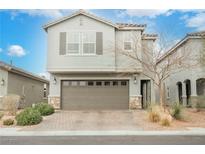 Charming two-story home featuring a spacious two-car garage and beautifully landscaped front yard at 4243 Tarim St, Las Vegas, NV 89147
