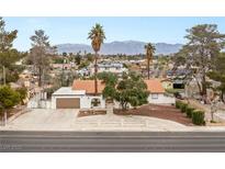 Charming single-story home featuring desert landscaping, a spacious driveway, and a red tile roof at 5248 W Lake Mead Blvd, Las Vegas, NV 89108