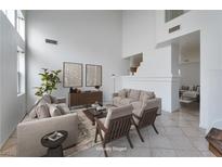 Bright living room boasting neutral tones, modern decor, and an open floor plan for comfortable living at 6276 Back Woods Rd, Las Vegas, NV 89142