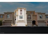 Inviting townhomes showcasing unique architectural details and integrated garages at 10091 Sand Key St, Las Vegas, NV 89178