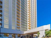 High-rise building exterior featuring a covered entrance and large windows and balconies at 135 E Harmon Ave # 2104, Las Vegas, NV 89109