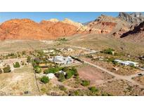 Stunning aerial view of a rural property nestled amidst majestic mountains, showcasing the natural beauty and serene surroundings at 14525 Heyer Way, Las Vegas, NV 89161