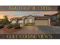 Charming single-story home featuring a well-maintained lawn and golf course views at 2920 Foxtail Creek Ave, Henderson, NV 89052