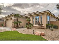 Charming single-story home featuring a well-maintained yard with desert landscaping and stone accents at 3 Chatmoss Rd, Henderson, NV 89052