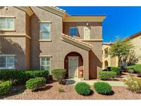 Inviting two-story condo featuring stucco, and a well-manicured lawn in a quiet neighborhood at 3825 Juno Beach St # 103, Las Vegas, NV 89129