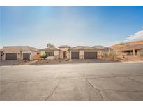 Charming single story home featuring a neutral palette, two car garage, and desert landscaping at 479 Apogee, Mesquite, NV 89027