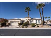 Charming single-story home with lush landscaping and a well-manicured lawn at 4845 Santo Romeo St, Las Vegas, NV 89135