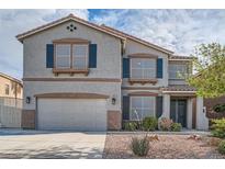 Charming two-story home featuring a two-car garage and inviting front yard at 823 Safflower Ct, Henderson, NV 89015