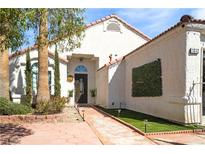 Charming single-story home showcasing a well-maintained front yard and unique desert landscaping at 1312 Frost Flower Dr, North Las Vegas, NV 89032
