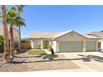 Charming single-story home with a spacious driveway and three-car garage in a well-maintained neighborhood at 2151 Babylon Mill St, Henderson, NV 89002