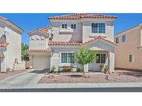 Charming two-story home with a well-maintained yard and a two-car garage at 2420 Belt Buckley Dr, Henderson, NV 89002