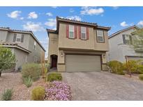 Two-story home featuring a two-car garage, neutral color palette, and well-maintained front yard at 2945 Torreon Ln, Las Vegas, NV 89121