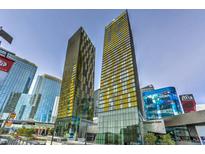 Striking architecture showcased in this high-rise exterior shot, with vibrant buildings against a clear blue sky at 3722 Las Vegas Blvd # 1204, Las Vegas, NV 89158