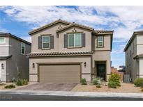 Charming two-story home with a two car garage and desert landscaping in a Gathering-friendly neighborhood at 6130 Sinks Canyon Ave, Las Vegas, NV 89130