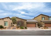 Charming one-story home with a well-manicured front yard and a two-car garage at 6925 Cuddy Falls Pl, North Las Vegas, NV 89084