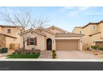 Charming single-story home features a two-car garage, manicured lawn, and a welcoming entryway at 896 Janefield St, Las Vegas, NV 89148