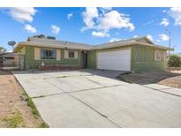 Charming single-story home with a driveway and a two-car garage at 4431 Bennett Dr, Las Vegas, NV 89121
