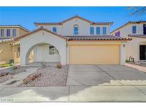 Charming two-story home featuring a two-car garage and a beautiful desert-landscaped front yard at 5733 Rose Tiara Dr, Las Vegas, NV 89139