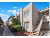 Exterior view of the building showing the stairs and stucco facade on a sunny day at 6800 E Lake Mead Blvd # 2091, Las Vegas, NV 89156