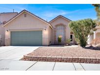 Charming single-story home featuring a two-car garage, well-kept landscaping, and a cozy, inviting entrance at 7129 Eyebright St, Las Vegas, NV 89131