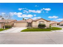 Charming single-story home with well-manicured lawn and desert-friendly landscaping in a quiet neighborhood at 7489 Tomahawk Bend Ave, Las Vegas, NV 89113