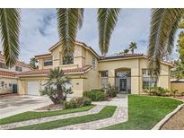 Charming two-story home with tile roof, desert landscaping and a two car garage at 8324 Slate Harbor Cir, Las Vegas, NV 89128