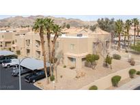 Condo exterior with desert landscaping, tile roof, and covered parking in a gated community at 2160 Highpointe Dr # 103, Laughlin, NV 89029