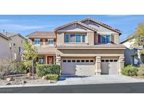 Inviting two-story home with a well-manicured yard and a spacious three-car garage at 3065 Lenoir St, Las Vegas, NV 89135