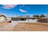 Single story home featuring simple landscaping, attached garage, and neutral color palette at 352 Cox Ave, Overton, NV 89040