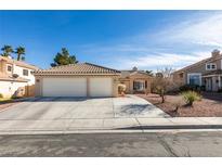 Charming single-story home featuring a two-car garage, tile roof, and desert landscaping at 455 Paulson Dr, Las Vegas, NV 89123