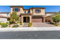 Charming two-story home with a well-maintained front yard and covered porch at 456 Lost Horizon Ave, Henderson, NV 89002