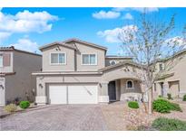 Charming two-story home with a two-car garage and landscaped front yard at 4633 Therapeutic St, North Las Vegas, NV 89031