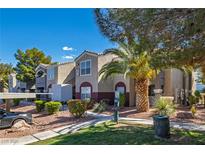 Inviting condo complex featuring well-manicured lawns, mature trees, and a convenient dog waste station at 5055 W Hacienda Ave # 1101, Las Vegas, NV 89118