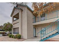 Two story home with well maintained landscaping and stairs to balcony at 5161 Lindell Rd # 201, Las Vegas, NV 89118