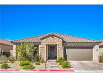 Charming single-story home featuring stone accents, a tile roof, and well-manicured landscaping at 6593 Corsari Ridge St, Las Vegas, NV 89166